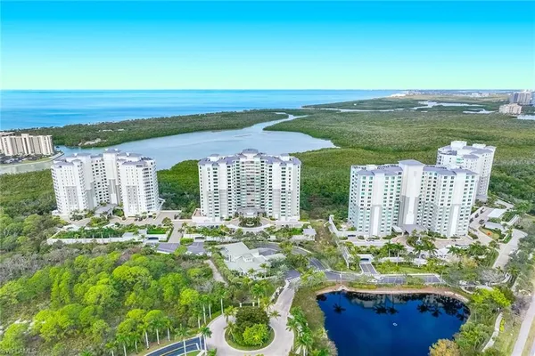 a view of a patio with furniture and garden
