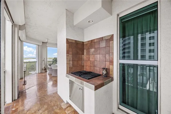 a kitchen that has a sink and a stove
