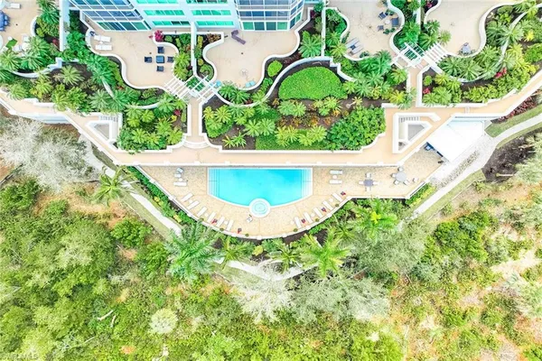 a view of a swimming pool with a garden