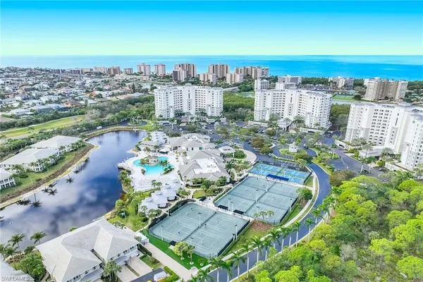 an aerial view of multiple house with yard