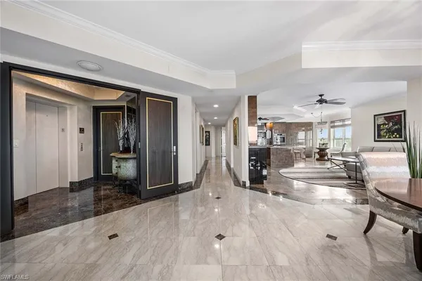a view of a living room and kitchen view
