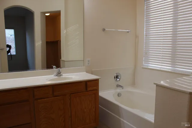 a bathroom with a bathtub and a sink