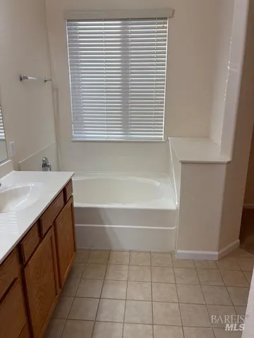 a bathroom with a glass shower door and a toilet