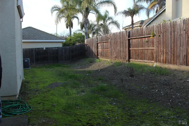 a view of a back yard of the house