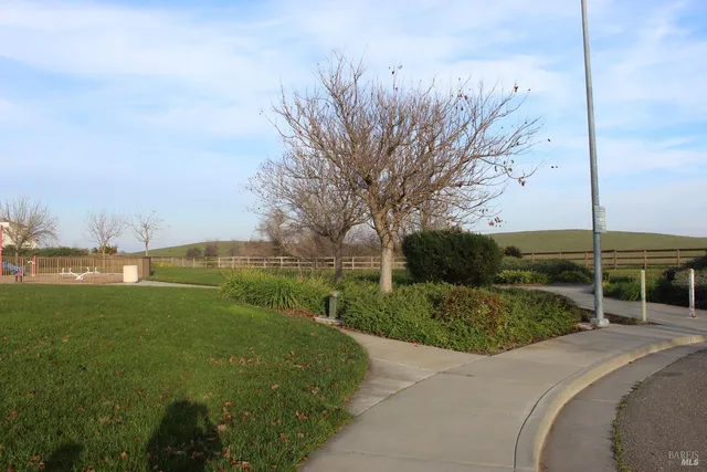a view of building with outdoor space and seating