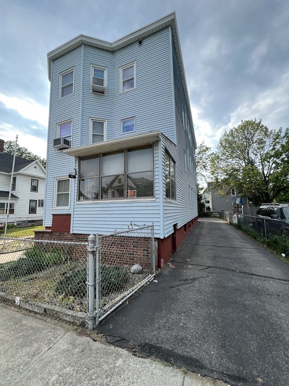 39-41 Keith Street Springfield, MA 01108 - Photo 1 of 7 a view of a house with a street
