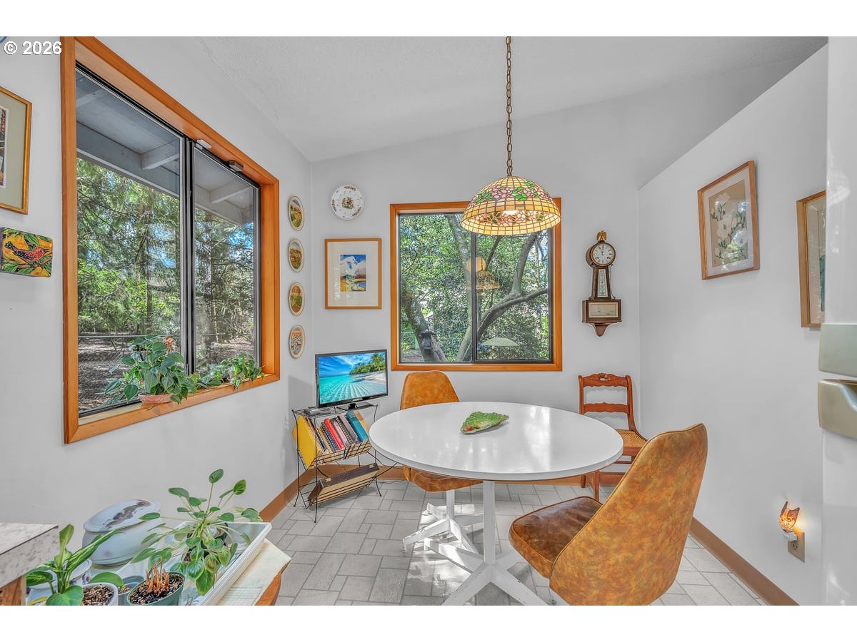 9200 Southwest Elrose Court Portland, OR 97224 - Photo 19 of 46 a balcony with furniture and a large window