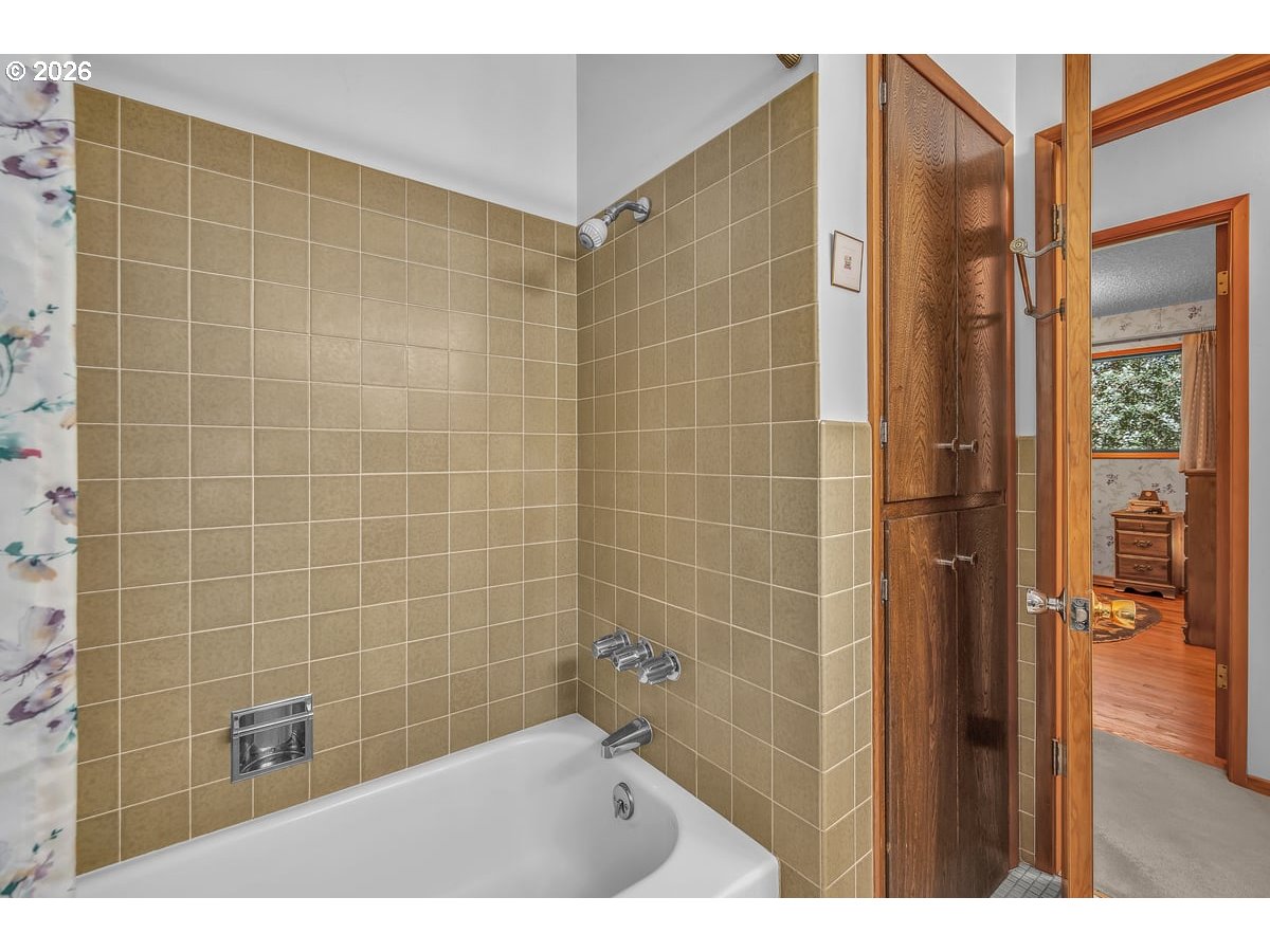 9200 Southwest Elrose Court Portland, OR 97224 - Photo 25 of 46 a bathroom with a shower and a sink