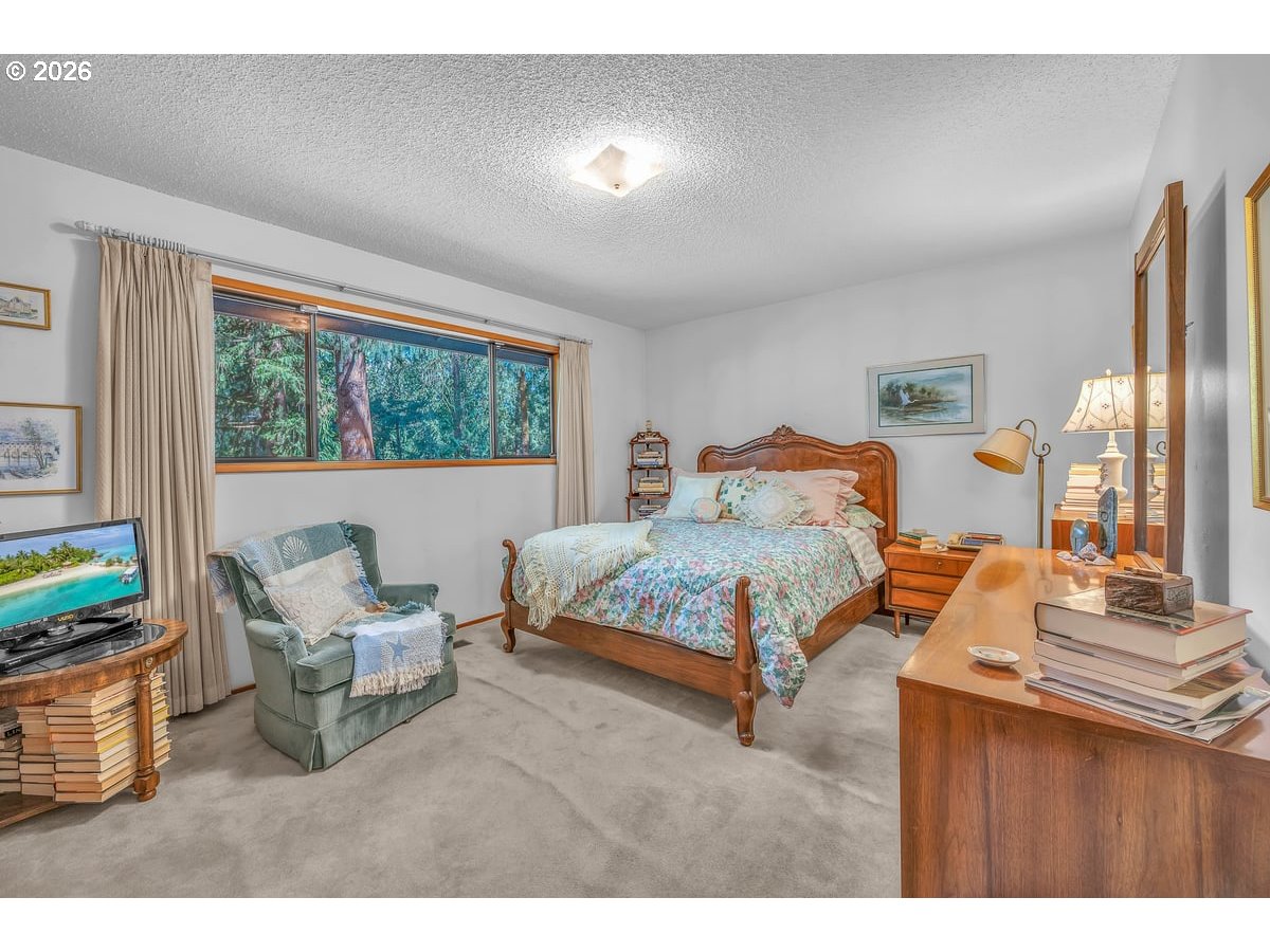 9200 Southwest Elrose Court Portland, OR 97224 - Photo 26 of 46 a bedroom with furniture and a large window