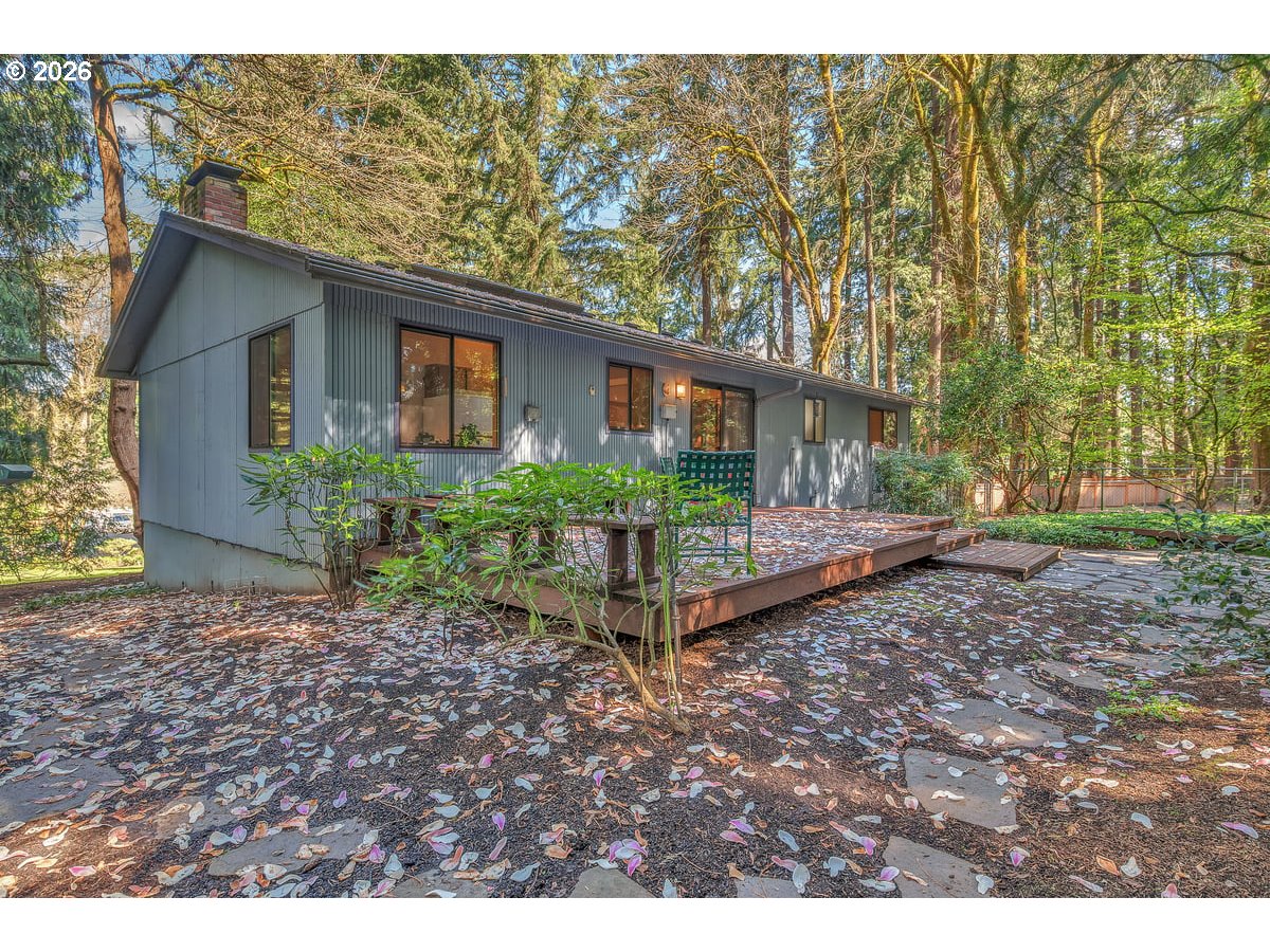 9200 Southwest Elrose Court Portland, OR 97224 - Photo 40 of 46 a backyard of a house with plants and outdoor seating