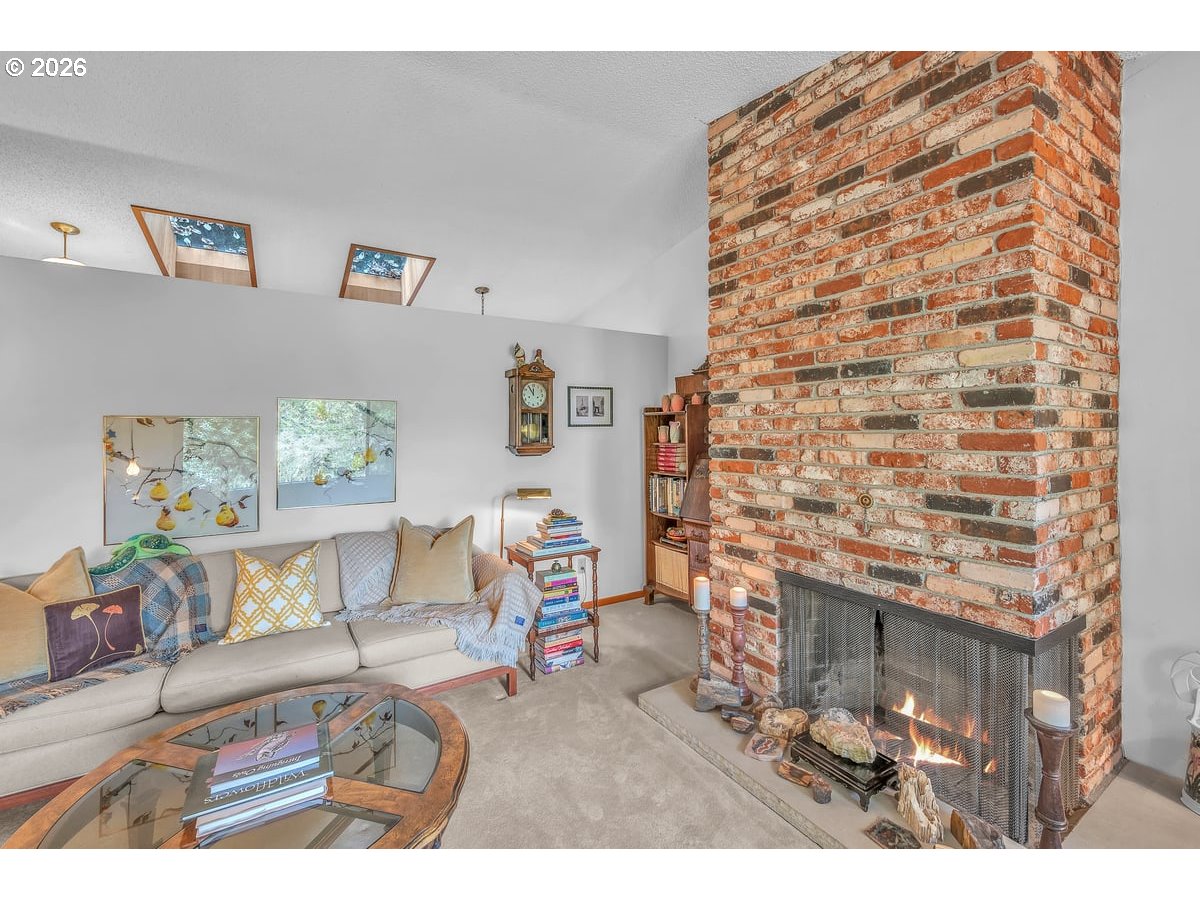 9200 Southwest Elrose Court Portland, OR 97224 - Photo 10 of 46 a living room with furniture and a fireplace