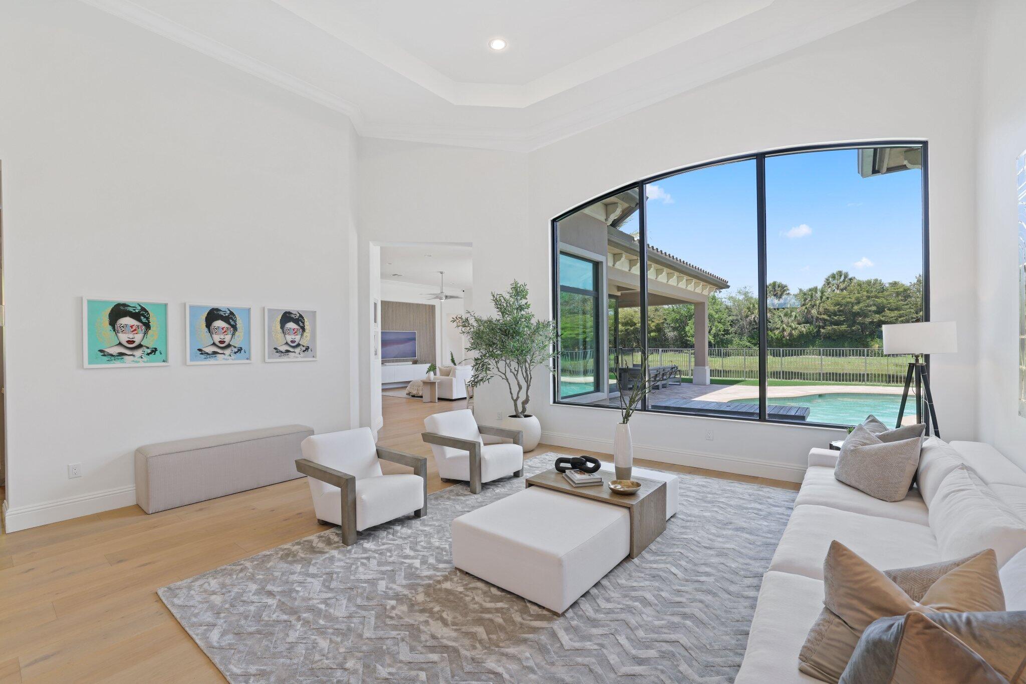 9599 Moritz Way Delray Beach, FL 33446 - Photo 5 of 75 a living room with furniture and a large window
