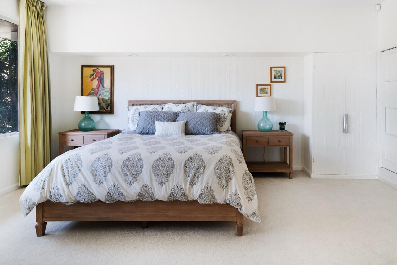 950 Monte Drive Santa Barbara, CA 93110 - Photo 23 of 39 a bedroom with a bed and table