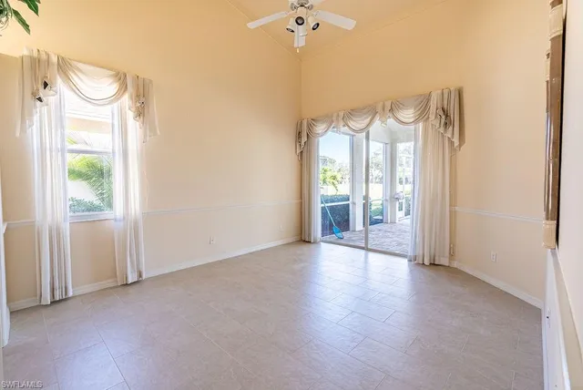 a view of a bathroom with closet and mirror