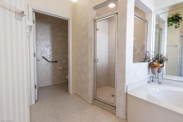 a bathroom with a double vanity sink mirror and