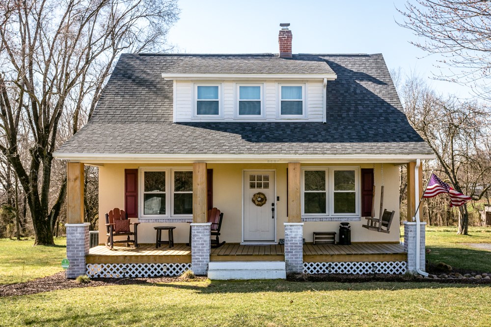 8687 Union Springs Road Dayton, VA 22821 - Photo 1 of 37 front view of a house with a porch