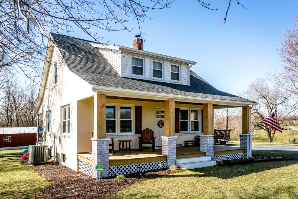 8687 Union Springs Road Dayton, VA 22821 - Photo 20 of 37 a front view of house with yard outdoor seating and barbeque oven