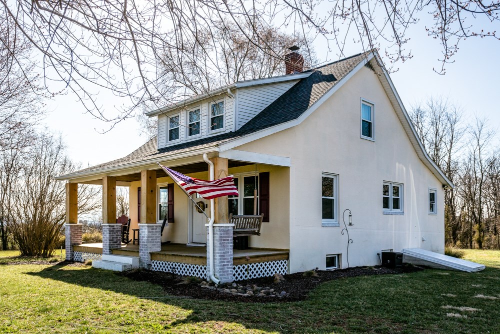 8687 Union Springs Road Dayton, VA 22821 - Photo 21 of 37 a front view of house with yard