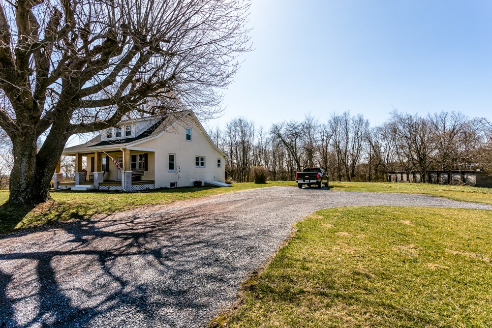 8687 Union Springs Road Dayton, VA 22821 - Photo 31 of 37 a view of a white house with a yard