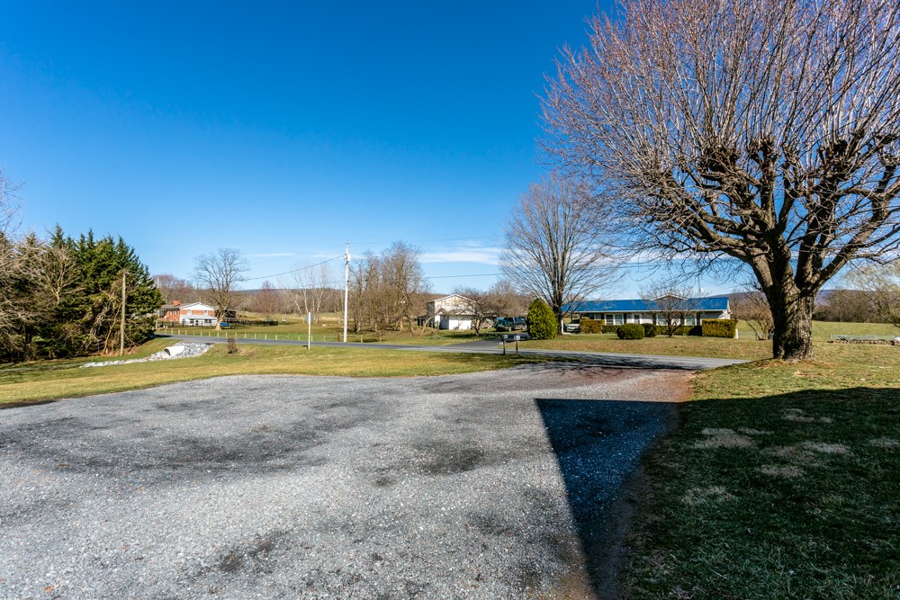 8687 Union Springs Road Dayton, VA 22821 - Photo 32 of 37 a view of a house with a yard