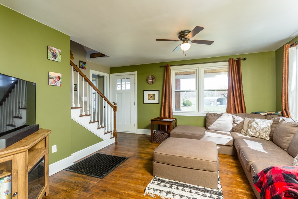 8687 Union Springs Road Dayton, VA 22821 - Photo 5 of 37 a living room with furniture and a large window