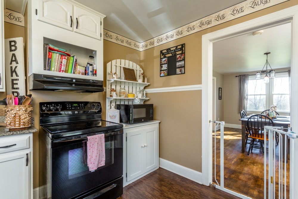 8687 Union Springs Road Dayton, VA 22821 - Photo 6 of 37 a kitchen with stainless steel appliances granite countertop a stove and a refrigerator