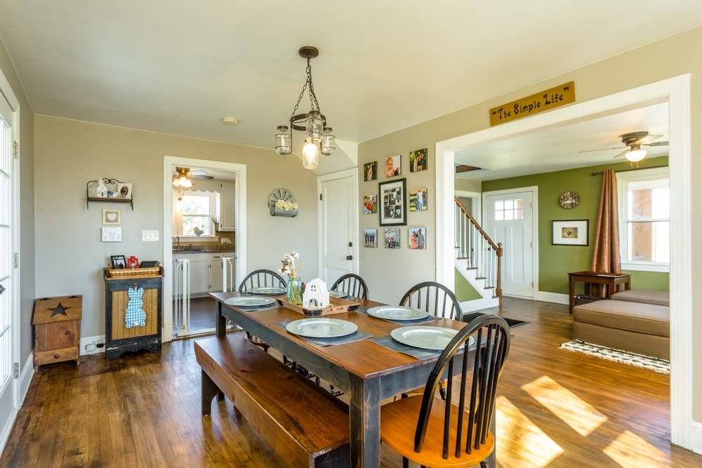 8687 Union Springs Road Dayton, VA 22821 - Photo 8 of 37 a view of a dining room with furniture and wooden floor