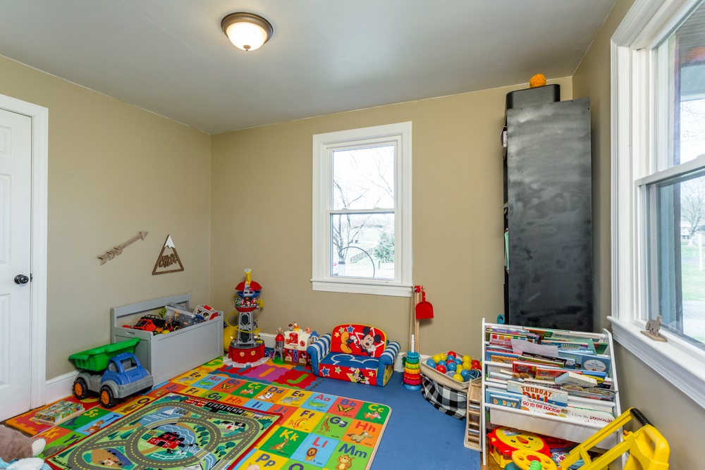 8687 Union Springs Road Dayton, VA 22821 - Photo 10 of 37 a room with toys and a book shelf