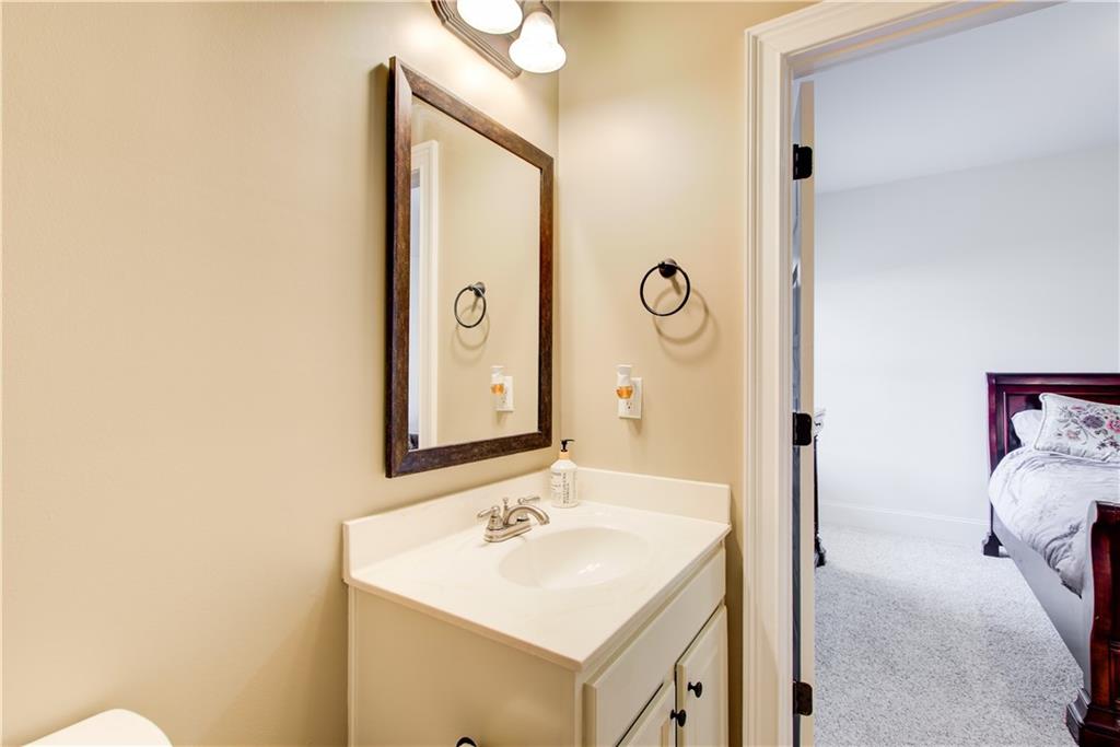 1979 Trinity Mill Drive Dacula, GA 30019 - Photo 12 of 26 a bathroom with a sink and a mirror
