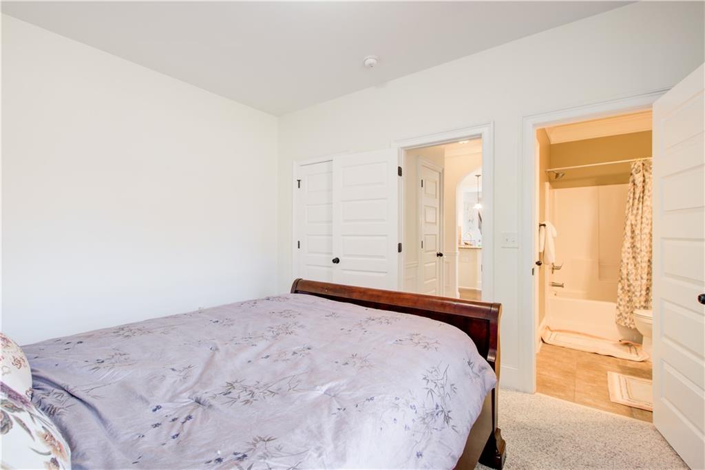 1979 Trinity Mill Drive Dacula, GA 30019 - Photo 13 of 26 a bedroom with a bed and a window