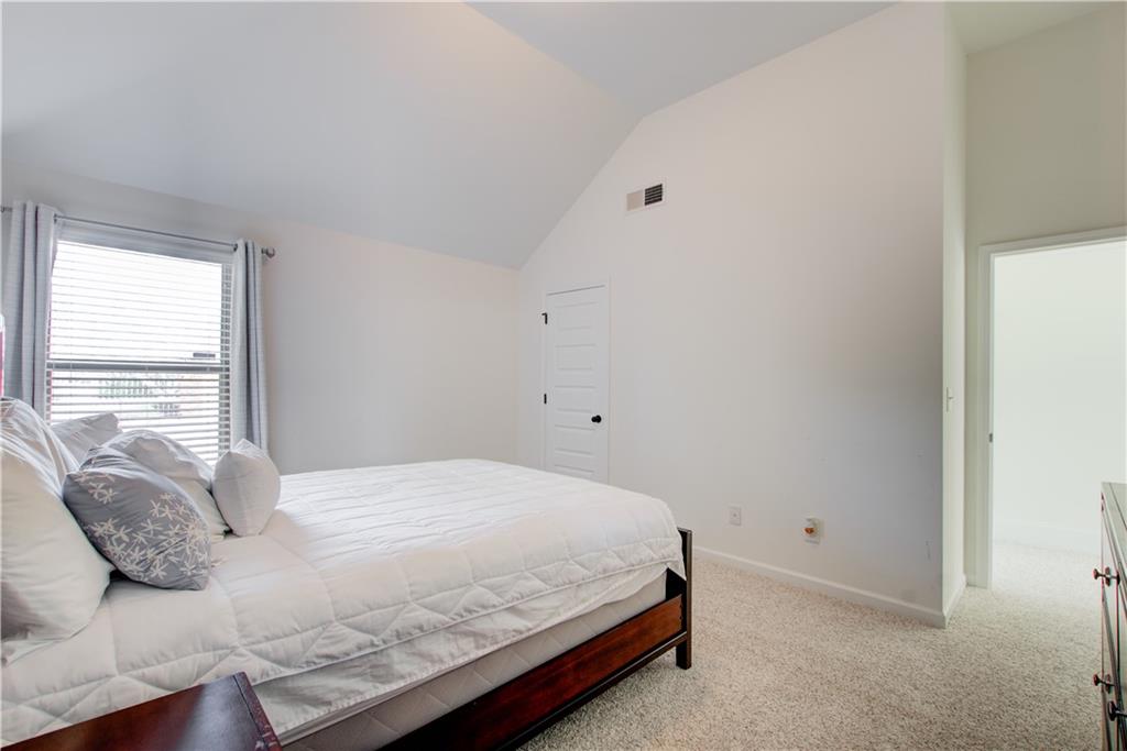 1979 Trinity Mill Drive Dacula, GA 30019 - Photo 15 of 26 a bedroom with a bed and a window