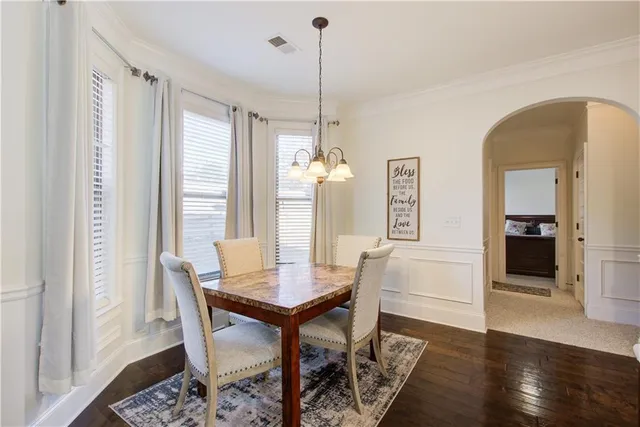 a large kitchen with a large window and stainless steel appliances