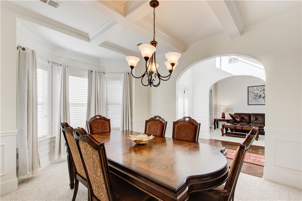 1979 Trinity Mill Drive Dacula, GA 30019 - Photo 7 of 26 a view of a dining room with furniture and chandelier