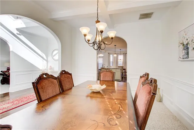 a kitchen with granite countertop cabinets stainless steel appliances and a wooden floor