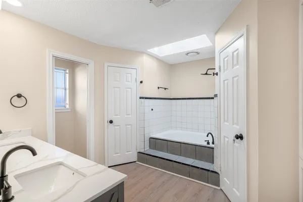 a bathroom with a sink and mirror