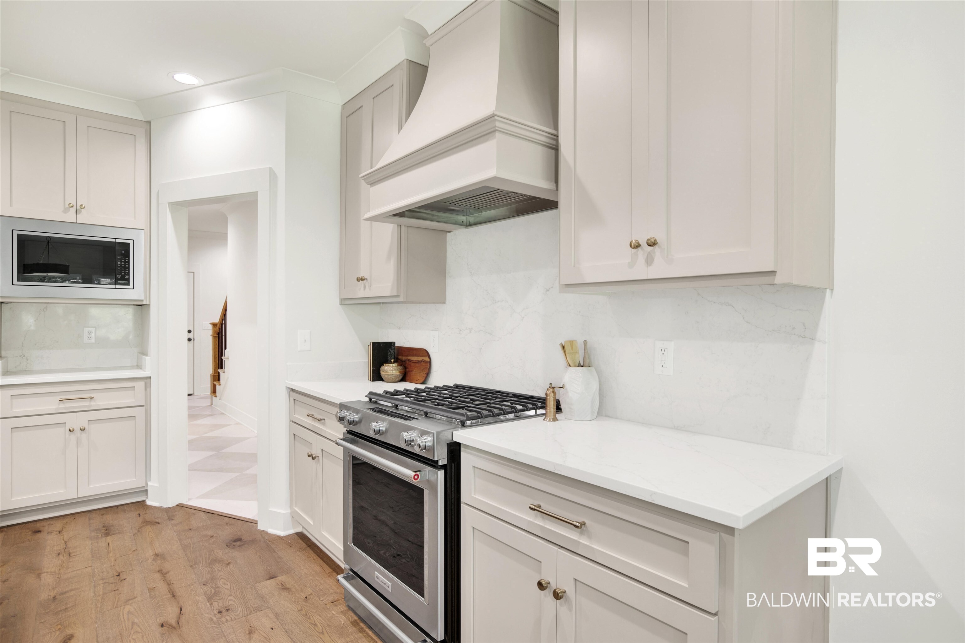 9275 Clarke Ridge Road Foley, AL 36535 - Photo 16 of 43 Kitchen with premium range hood, appliances with stainless steel finishes, backsplash, recessed lighting, and light stone counters