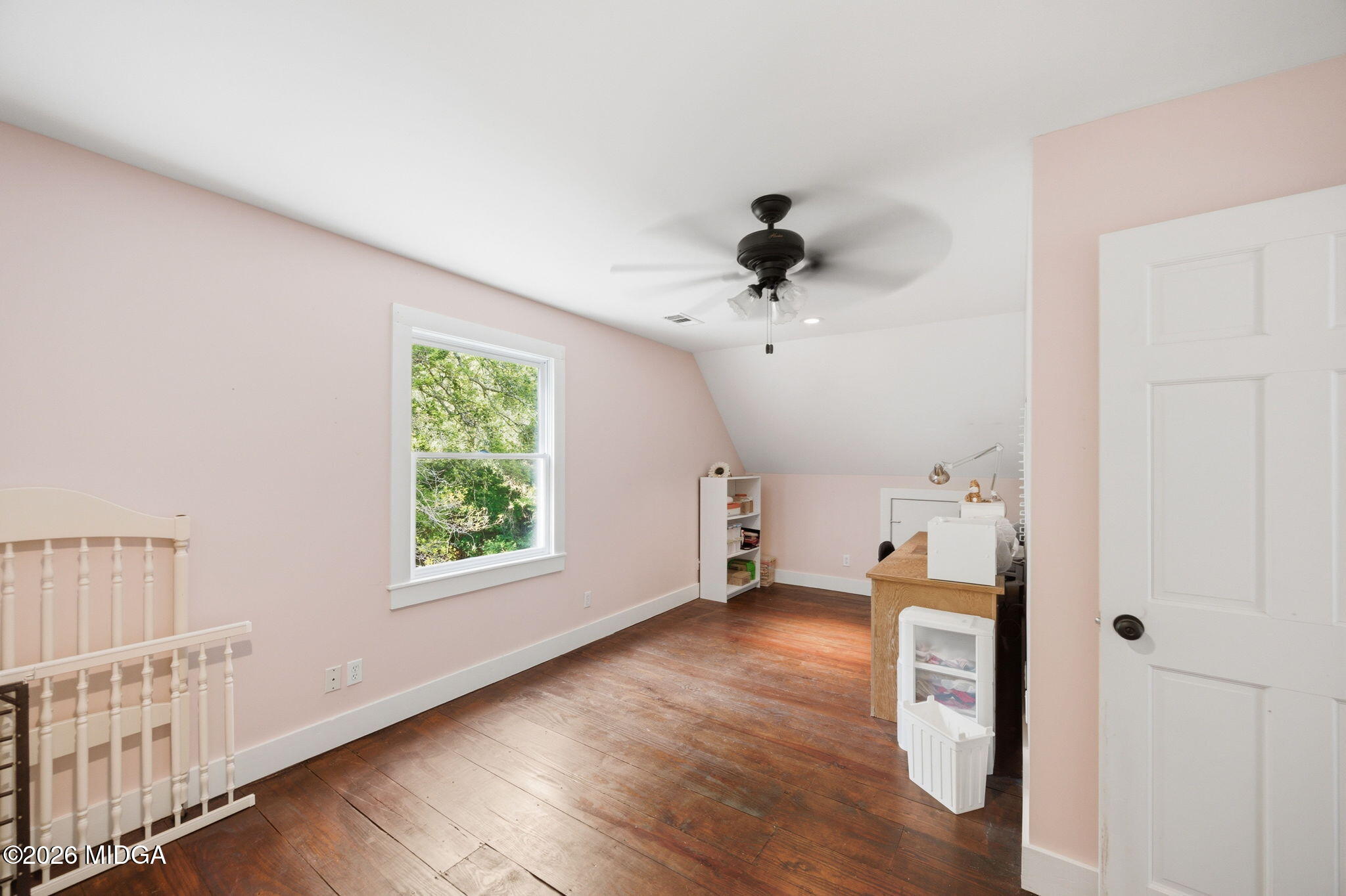 4686 Johnstonville Road Forsyth, GA 31029 - Photo 22 of 34 an empty room with wooden floor and windows