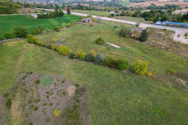 a aerial view of a house with a yard