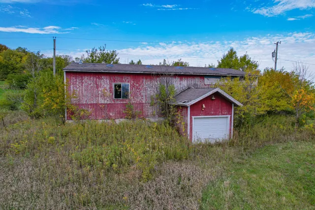 a aerial view of a house with a yard