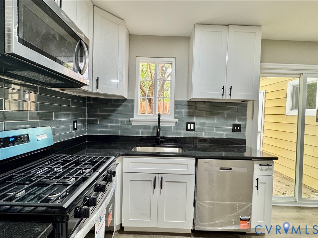 403 Roxana Road Henrico, VA 23075 - Photo 2 of 42 White shaker-style cabinetry with black hardware,