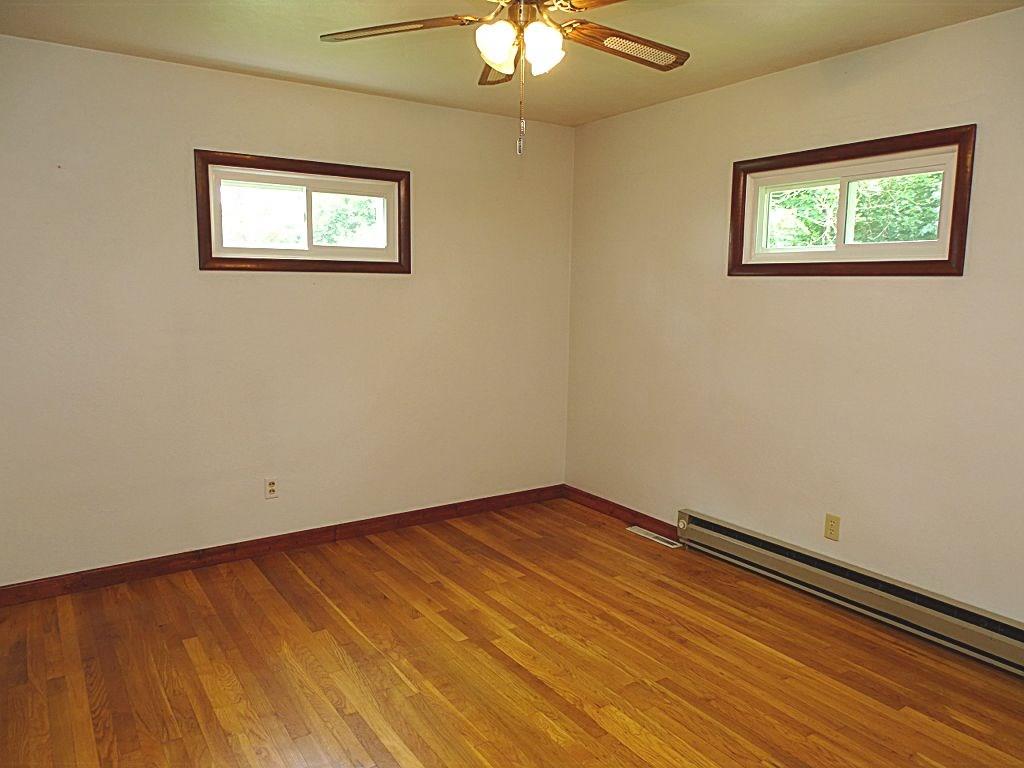 190 Deerfield Road Washington, PA 15301 - Photo 14 of 25 Bedroom #2 also with gleaming hardwood floor, ceiling fan/light fixture & 2 large double door closets