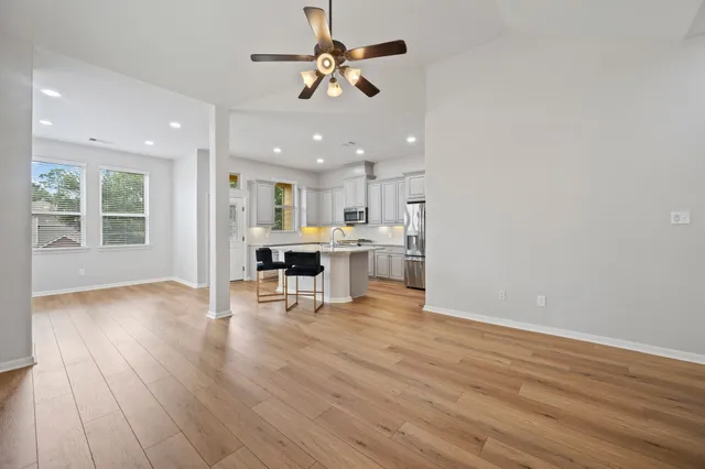 a view of kitchen with cabinets and wooden floor
