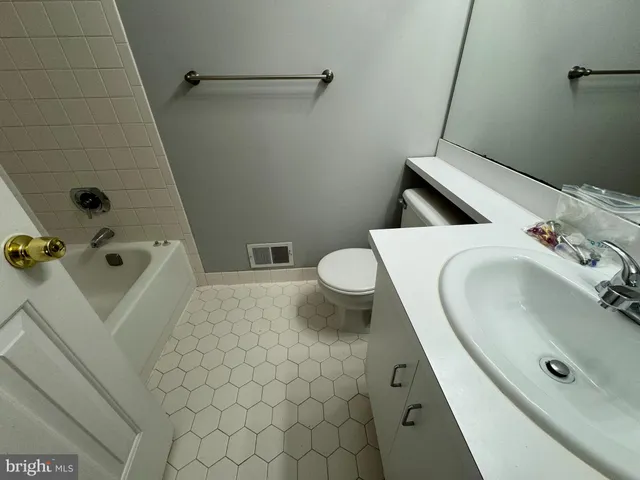 a bathroom with a sink and toilet