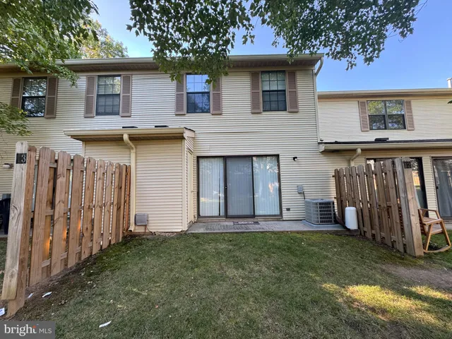 a view of a house with backyard of the house