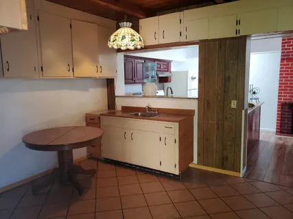 a kitchen with stainless steel appliances a refrigerator and cabinets