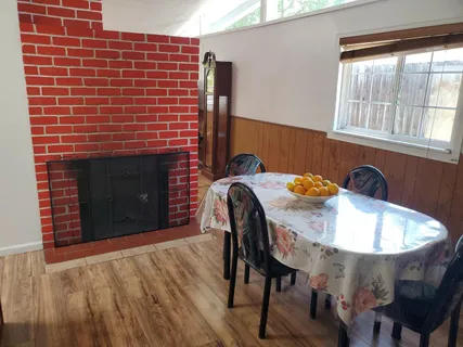 a dining room with furniture and window