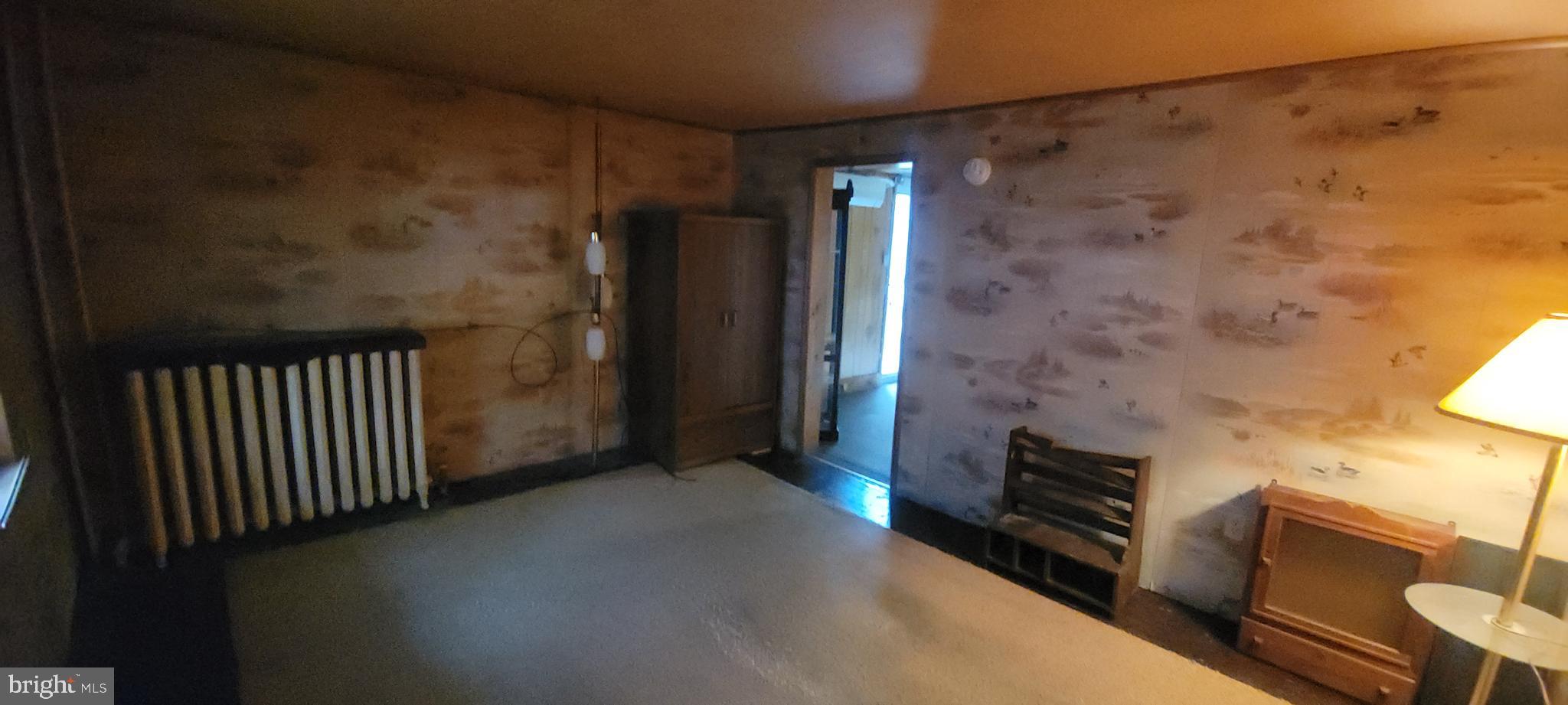 511 Mount Olive Blvd. Shenandoah, PA 17976 - Photo 16 of 34 a view of a hallway with wooden floor and staircase