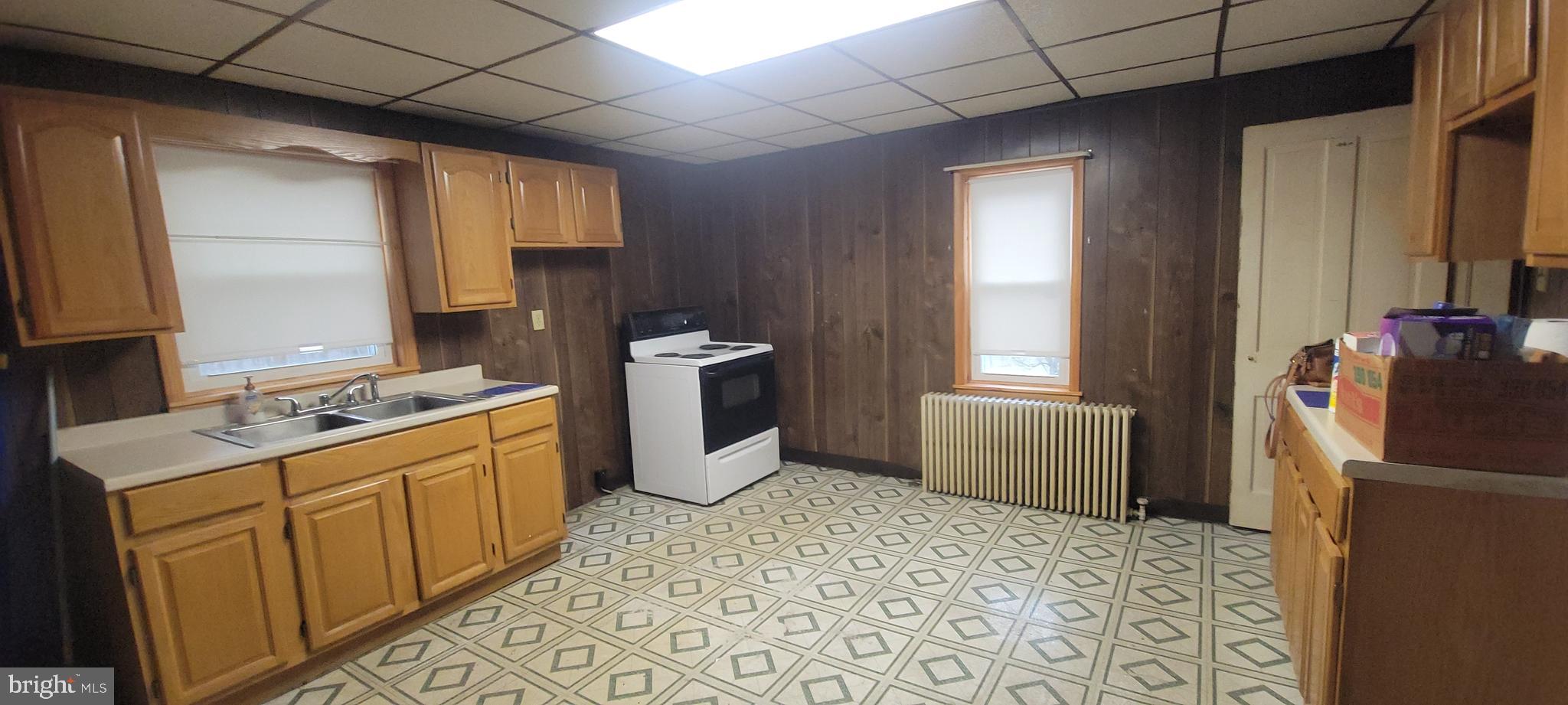 511 Mount Olive Blvd. Shenandoah, PA 17976 - Photo 9 of 34 a kitchen with sink cabinets and wooden floor