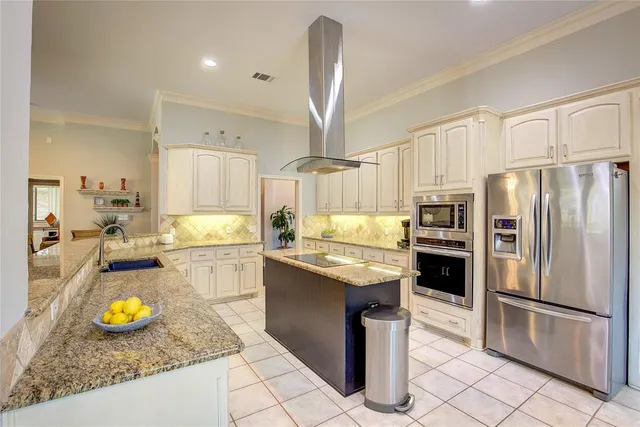 a kitchen with a sink a stove and refrigerator