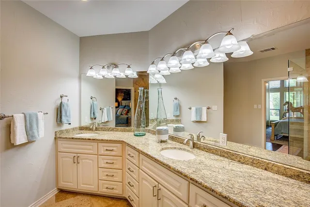 a bathroom with a shower and a sink